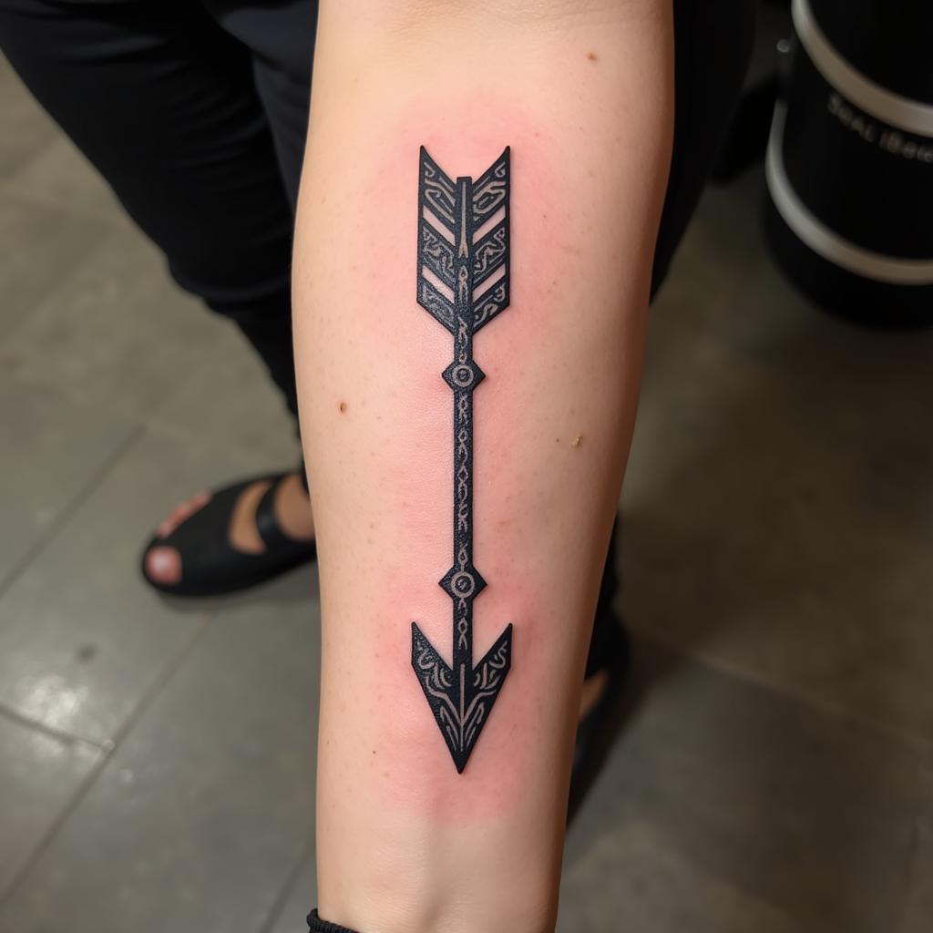 African Arrow Tattoo with Tribal Patterns