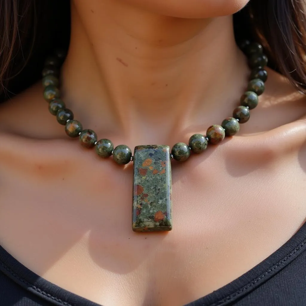 A person wearing African jasper jewelry