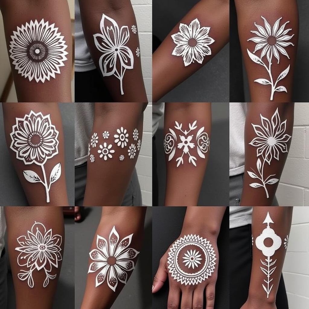 Variety of white ink tattoo designs on dark skin