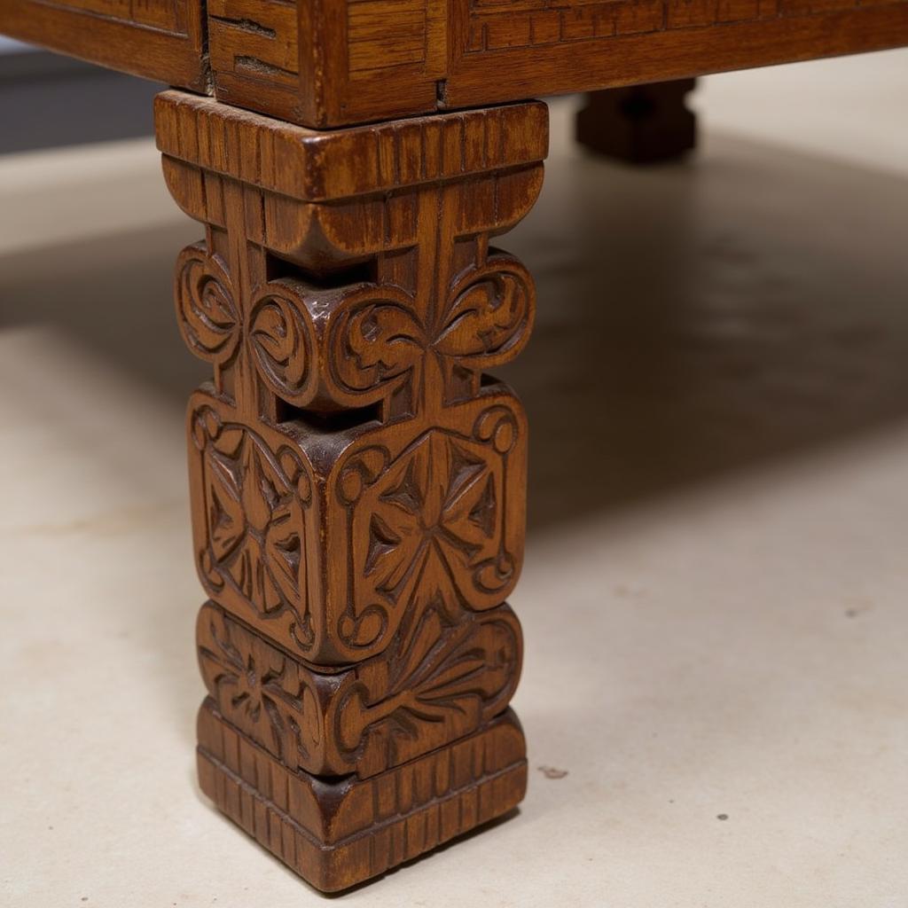 Hand-carved African coffee table with intricately designed wooden legs, showcasing traditional artistry.